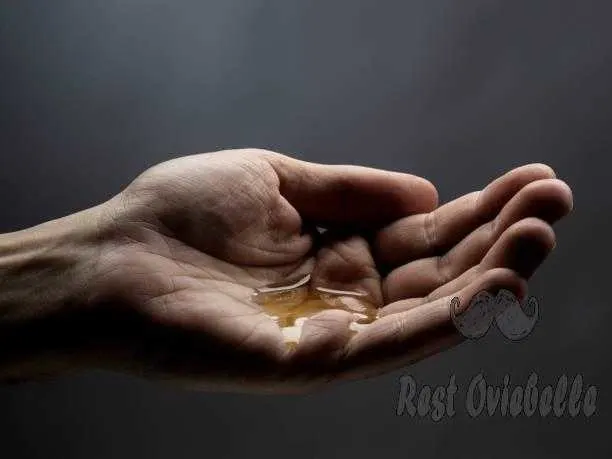 man hand with oil best pre-shave oils