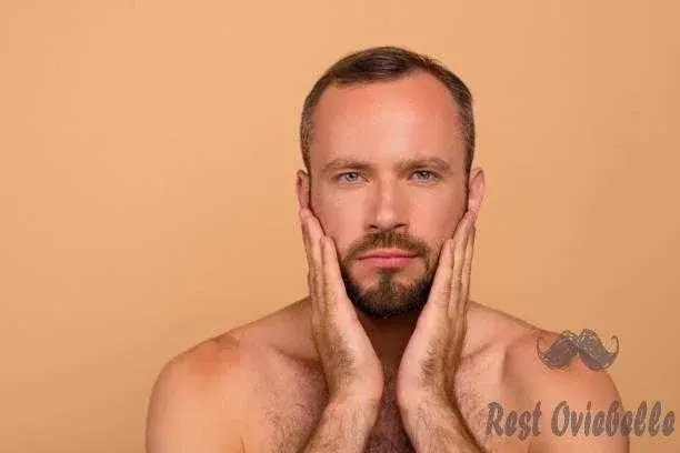 Portrait of nice confident well-groomed attractive handsome man After trim a beard with scissors