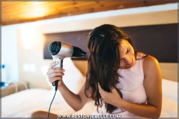Woman drying her hair